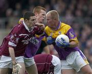 16 June 2001; Willie Carley of Wexford in action against Fergal Wilson of Westmeath during the Bank of Ireland All-Ireland Senior Football Championship Qualifier Round 1 Replay match between Westmeath and Wexford at Cusack Park in Mullingar, Westmeath. Photo by Ray McManus/Sportsfile