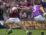 16 June 2001; Ger Heavin of Westmeath in action against Philip Wallace of Wexford during the Bank of Ireland All-Ireland Senior Football Championship Qualifier Round 1 Replay match between Westmeath and Wexford at Cusack Park in Mullingar, Westmeath. Photo by Ray McManus/Sportsfile