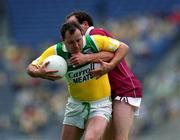 17 June 2001; Peter Brady of Offaly is tackled by Joe Corroon of Westmeath during the Leinster Junior Football Championship Semi-Final match between Offaly and Westmeath at Croke Park in Dublin. Photo by Ray McManus/Sportsfile