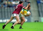 17 June 2001; Peter Brady of Offaly is tackled by Joe Corroon of Westmeath during the Leinster Junior Football Championship Semi-Final match between Offaly and Westmeath at Croke Park in Dublin. Photo by Ray McManus/Sportsfile