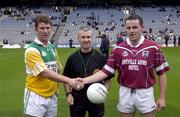17 June 2001; Offaly captain Tom Coffey, left, shakes hands with Westmeath captain Adrian Corcoran, in front of referee Paul Devlin ahead of the Leinster Junior Football Championship Semi-Final match between Offaly and Westmeath at Croke Park in Dublin. Photo by Ray McManus/Sportsfile