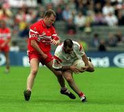 17 June 2001; Declan McCrossan of Tyrone is tackled by Johnny McBride of Derry during the Bank of Ireland Ulster Senior Football Championship Semi-Final match between Tyrone and Derry at St Tiernach's Park in Clones, Monaghan. Photo by Damien Eagers/Sportsfile