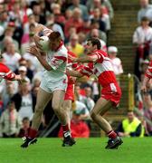 17 June 2001; Ciaran McBride of Tyrone in action against Gareth Doherty of Derry during the Bank of Ireland Ulster Senior Football Championship Semi-Final match between Tyrone and Derry at St Tiernach's Park in Clones, Monaghan. Photo by Damien Eagers/Sportsfile