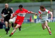 17 June 2001; Paul Younge of Derry in action against Dermot Carlin of Tyrone during the Bank of Ireland Ulster Senior Football Championship Semi-Final match between Tyrone and Derry at St Tiernach's Park in Clones, Monaghan. Photo by Damien Eagers/Sportsfile