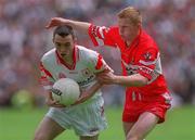 17 June 2001; Niall Gormley of Tyrone in action against Philip Mooney of Derry during the Bank of Ireland Ulster Senior Football Championship Semi-Final match between Tyrone and Derry at St Tiernach's Park in Clones, Monaghan. Photo by Damien Eagers/Sportsfile