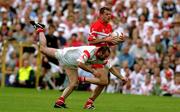17 June 2001; Anthony Tohill of Derry in action against Declan McCrossan of Tyrone during the Bank of Ireland Ulster Senior Football Championship Semi-Final match between Tyrone and Derry at St Tiernach's Park in Clones, Monaghan. Photo by Damien Eagers/Sportsfile