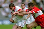 17 June 2001; Stephen O'Neill of Tyrone in action against Anthony Tohill of Derry during the Bank of Ireland Ulster Senior Football Championship Semi-Final match between Tyrone and Derry at St Tiernach's Park in Clones, Monaghan. Photo by Damien Eagers/Sportsfile