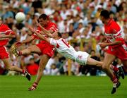 17 June 2001; Anthony Tohill of Derry in action against Peter Canavan of Tyrone during the Bank of Ireland Ulster Senior Football Championship Semi-Final match between Tyrone and Derry at St Tiernach's Park in Clones, Monaghan. Photo by Damien Eagers/Sportsfile