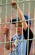 17 June 2001; Dublin supporter Tommy Murdiff, age 6, wathes on from Hill 16 during the Bank of Ireland Leinster Senior Football Championship Semi-Final match between Dublin and Offaly at Croke Park in Dublin. Photo by Ray McManus/Sportsfile