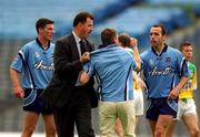 17 June 2001; A Dublin supporter, who ran onto the pitch in protest, is restrained by Dublin County Board Secretary John Costello and Ian Robertson of Dublin during the Bank of Ireland Leinster Senior Football Championship Semi-Final match between Dublin and Offaly at Croke Park in Dublin. Photo by Ray McManus/Sportsfile