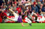 16 June 2001; Cathal Keane of Westmeath in action against David Murphy of Wexford during the Bank of Ireland All-Ireland Senior Football Championship Qualifier Round 1 Replay match between Westmeath and Wexford at Cusack Park in Mullingar, Westmeath. Photo by Ray McManus/Sportsfile