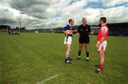 9 June 2001; Referee Gerry Kinneavy in conversation with team captains, Liam Cronin of Tipperary and Nicky Malone of Louth, ahead of the first ever Bank of Ireland All-Ireland Senior Football Championship Qualifier Round 1 match between Tipperary and Louth at Clonmel Sportsfield in Clonmel, Tipperary. Photo by Brendan Moran/Sportsfile