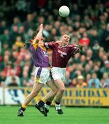 16 June 2001; Cathal Keane of Westmeath battles for possession against David Murphy of Wexford during the Bank of Ireland All-Ireland Senior Football Championship Qualifier Round 1 Replay match between Westmeath and Wexford at Cusack Park in Mullingar, Westmeath. Photo by Ray McManus/Sportsfile