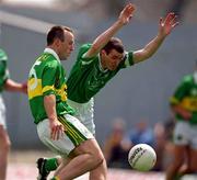 17 June 2001; John Crowley of Kerry in action against Tommy Stack of Limerick during the Bank of Ireland Munster Senior Football Championship Semi-Final match between Kerry and Limerick at Fitzgerald Stadium in Killarney, Kerry. Photo by Brendan Moran/Sportsfile