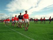 9 June 2001; Armagh captain Kieran McGeeney leads his side during the pre-match parade ahead of the Bank of Ireland All-Ireland Senior Football Championship Qualifier Round 1 match between Down and Armagh at Casement Park in Belfast. Photo by Ray McManus/Sportsfile