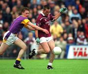 16 June 2001; Michael Ennis of Westmeath in action against David Murphy of Wexford during the Bank of Ireland All-Ireland Senior Football Championship Qualifier Round 1 Replay match between Westmeath and Wexford at Cusack Park in Mullingar, Westmeath. Photo by Ray McManus/Sportsfile