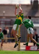 17 June 2001; Michael Francis Russell of Kerry gathers possession of a high-ball against Mark O'Riordan of Limerick during the Bank of Ireland Munster Senior Football Championship Semi-Final match between Kerry and Limerick at Fitzgerald Stadium in Killarney, Kerry. Photo by Brendan Moran/Sportsfile