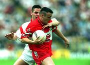 17 June 2001; Patrick Bradley of Derry is tackled by Michael McGee of Tyrone during the Bank of Ireland Ulster Senior Football Championship Semi-Final match between Tyrone and Derry at St Tiernach's Park in Clones, Monaghan. Photo by Damien Eagers/Sportsfile