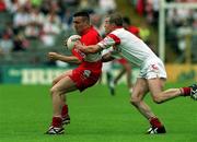 17 June 2001; Patrick Bradley of Derry is tackled by Sean Teague of Tyrone during the Bank of Ireland Ulster Senior Football Championship Semi-Final match between Tyrone and Derry at St Tiernach's Park in Clones, Monaghan. Photo by Damien Eagers/Sportsfile