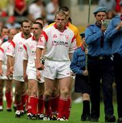 17 June 2001; Tyrone captain Sean Teague leads his side during the pre-match parade ahead of the Bank of Ireland Ulster Senior Football Championship Semi-Final match between Tyrone and Derry at St Tiernach's Park in Clones, Monaghan. Photo by Damien Eagers/Sportsfile