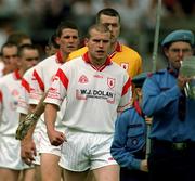 17 June 2001; Tyrone captain Sean Teague leads his side during the pre-match parade ahead of the Bank of Ireland Ulster Senior Football Championship Semi-Final match between Tyrone and Derry at St Tiernach's Park in Clones, Monaghan. Photo by Damien Eagers/Sportsfile