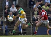 23 June 2001; Vinny Claffey of Offaly in action against Denis Reilly of Louth during the Bank of Ireland All-Ireland Senior Football Championship Qualifier Round 2 match between Louth and Offaly at Páirc Táilteann in Navan, Meath Photo by Ray McManus/Sportsfile