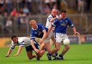 24 June 2001; James Doonan of Cavan is tackled by Jason Hughes of Monaghan during the Bank of Ireland Ulster Senior Football Championship Semi-Final match between Monaghan and Cavan at St Tiernach's Park in Clones, Monaghan. Photo by David Maher/Sportsfile