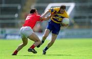 24 June 2001; Michael O'Shea of Clare in action against John Miskella of Cork during the Bank of Ireland Munster Senior Football Championship Semi-Final match between Cork and Clare in Pairc Ui Chaoimh in Cork. Photo by Brendan Moran/Sportsfile