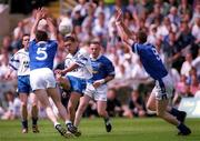 24 June 2001; Gary Meehan of Monaghan in action against Edward Jackson, 5, and Barry McCrudden of Cavan during the Bank of Ireland Ulster Senior Football Championship Semi-Final match between Monaghan and Cavan at St Tiernach's Park in Clones, Monaghan. Photo by David Maher/Sportsfile