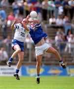 24 June 2001; Jason Hughes of Monaghan in action against John Tierney of Cavan during the Bank of Ireland Ulster Senior Football Championship Semi-Final match between Monaghan and Cavan at St Tiernach's Park in Clones, Monaghan. Photo by David Maher/Sportsfile