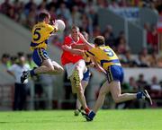 24 June 2001; Brendan Ger O'Sullivan of Cork in action against Barry Keating, 5, and Joe Considine of Clare during the Bank of Ireland Munster Senior Football Championship Semi-Final match between Cork and Clare in Pairc Ui Chaoimh in Cork. Photo by Brendan Moran/Sportsfile