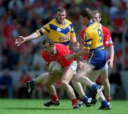 24 June 2001; John Miskella of Cork in action against Joe Considine, left, and Brian Considine of Clare during the Bank of Ireland Munster Senior Football Championship Semi-Final match between Cork and Clare in Pairc Ui Chaoimh in Cork. Photo by Brendan Moran/Sportsfile