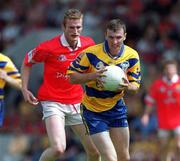 24 June 2001; Brian Considine of Clare in action against Nicholas Murphy of Cork during the Bank of Ireland Munster Senior Football Championship Semi-Final match between Cork and Clare in Pairc Ui Chaoimh in Cork. Photo by Brendan Moran/Sportsfile