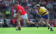 24 June 2001; Mark O'Sullivan of Cork in action against Donal O'Sullivan of Clare during the Bank of Ireland Munster Senior Football Championship Semi-Final match between Cork and Clare in Pairc Ui Chaoimh in Cork. Photo by Brendan Moran/Sportsfile