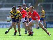 24 June 2001; Padraig Gallagher of Clare in action against Fionnan Murray, centre, and Conrad Murphy of Cork during the Bank of Ireland Munster Senior Football Championship Semi-Final match between Cork and Clare in Pairc Ui Chaoimh in Cork. Photo by Brendan Moran/Sportsfile