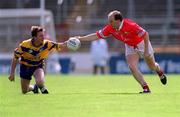24 June 2001; Ronan McCarthy of Cork in action against Joe Considine of Clare during the Bank of Ireland Munster Senior Football Championship Semi-Final match between Cork and Clare in Pairc Ui Chaoimh in Cork. Photo by Brendan Moran/Sportsfile