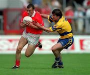 24 June 2001; John Miskella of Cork in action against Mark O'Connell of Clare during the Bank of Ireland Munster Senior Football Championship Semi-Final match between Cork and Clare in Pairc Ui Chaoimh in Cork. Photo by Brendan Moran/Sportsfile
