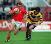 24 June 2001; John Miskella of Cork in action against Mark O'Connell of Clare during the Bank of Ireland Munster Senior Football Championship Semi-Final match between Cork and Clare in Pairc Ui Chaoimh in Cork. Photo by Brendan Moran/Sportsfile