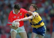 24 June 2001; Mark O'Sullivan of Cork in action against Philip Smyth of Clare during the Bank of Ireland Munster Senior Football Championship Semi-Final match between Cork and Clare in Pairc Ui Chaoimh in Cork. Photo by Brendan Moran/Sportsfile