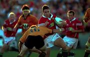 26 June 2001; David Wallace of British and Irish Lions is tackled by Matt Brown of New South Wales Country Cockatoos during the match between New South Wales Country Cockatoos and British and Irish Lions at the International Sports Stadium in Coffs Harbour in New South Wales, Australia. Photo by Matt Browne/Sportsfile