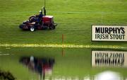 26 June 2001; A greenkeeper passes by the lake at the 18th green ahead of the Murphy's Irish Open Golf Championship at Fota Island Golf Club in Fota Island, Cork. Photo by Brendan Moran/Sportsfile