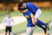 14 May 2016; Crumlin United's Gregory Moorhouse, below, celebrates with team-mate Carl Forsyth after scoring his side's fifth goal of the game. FAI Intermediate Cup Final, Crumlin United v Letterkenny Rovers. Aviva Stadium, Dublin. Picture credit: Ramsey Cardy / SPORTSFILE
