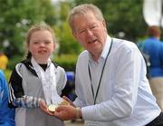 11 June 2010; Micheal O Muircheartaigh with Meg Carr, from Letterkenny, Co. Donegal, age 9, who is the youngest competing athlete and won 5 gold medals and 1 silver medal in Gymnastics, during the second day of the 2010 Special Olympics Ireland Games. University of Limerick, Limerick. Picture credit: Stephen McCarthy / SPORTSFILE