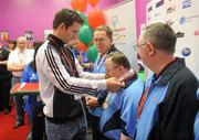 11 June 2010; Tipperary hurler Conor O'Mahony presents John Burrowes, Eastern Team 1, with his third place medal in the Team Bowling event during the second day of the 2010 Special Olympics Ireland Games. Funworld, Ennis Road, Limerick. Picture credit: Stephen McCarthy / SPORTSFILE