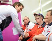 11 June 2010; Tipperary hurler Conor O'Mahony greets Munster athletes during the medal cermony at the Bowling event during the second day of the 2010 Special Olympics Ireland Games. Funworld, Ennis Road, Limerick. Picture credit: Stephen McCarthy / SPORTSFILE