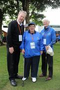 11 June 2010; Micheal O Muircheartaigh and athlete Nacy O'Sullivan, from Killaloe, Co. Clare, with assistant Margaret Connors, from Enniscorthy, Co. Wexford, right, during the Pitch & Putt event during the second day of the 2010 Special Olympics Ireland Games. Murroe, Limerick. Picture credit: Stephen McCarthy / SPORTSFILE