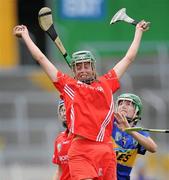 12 June 2010; Orla Cotter, Cork, fields the sliotar ahead of Julie McGrath, Tipperary. Gala All-Ireland Senior Camogie Championship, Tipperary v Cork, Semple Stadium, Thurles, Co. Tipperary. Picture credit: Brendan Moran / SPORTSFILE