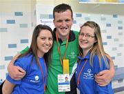 12 June 2010; Athlete Michael Flynn, from Carrowreagh, Co, Mayo, with volunteers Muireann O'Shaughnessy, left, and Aideen Hinch during the 2010 Special Olympics Ireland Games. University of Limerick, Limerick. Picture credit: Diarmuid Greene / SPORTSFILE