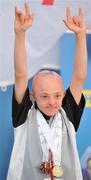12 June 2010; Sean Irvine, Belfast, Antrim, Ulster Region, celebrates after receiving his medal during the Gymnastics medal presentation during the third day of the 2010 Special Olympics Ireland Games. University of Limerick, Limerick. Picture credit: Stephen McCarthy / SPORTSFILE
