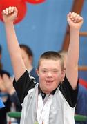 12 June 2010; Ryan Craig, from Belfast, Antrim, Ulster Region, on his way to picking up his gold medal at the Gymnastics presentation during the third day of the 2010 Special Olympics Ireland Games. University of Limerick, Limerick. Picture credit: Stephen McCarthy / SPORTSFILE
